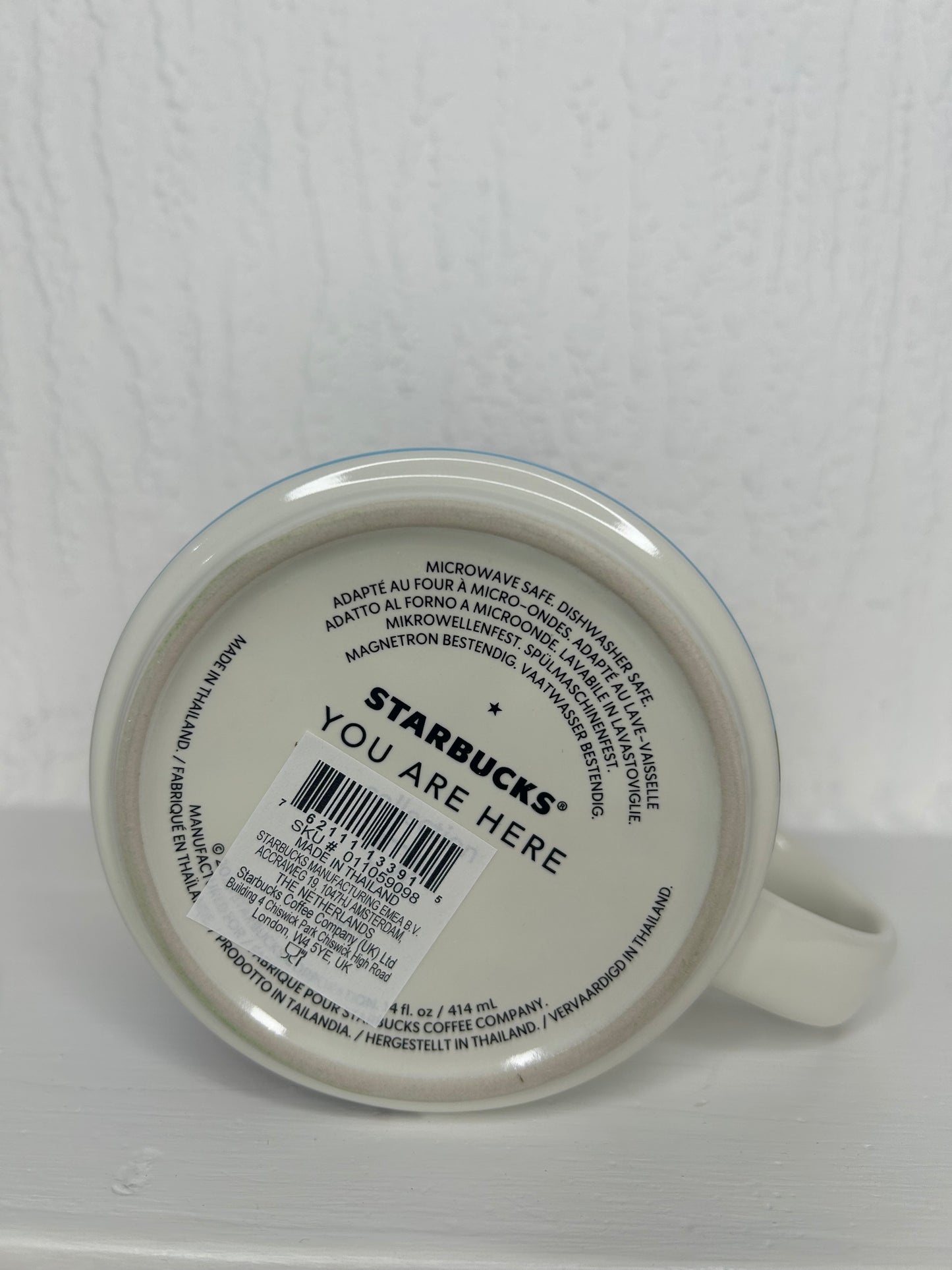 Underside of Starbucks London mug showing official logo and ceramic imprint