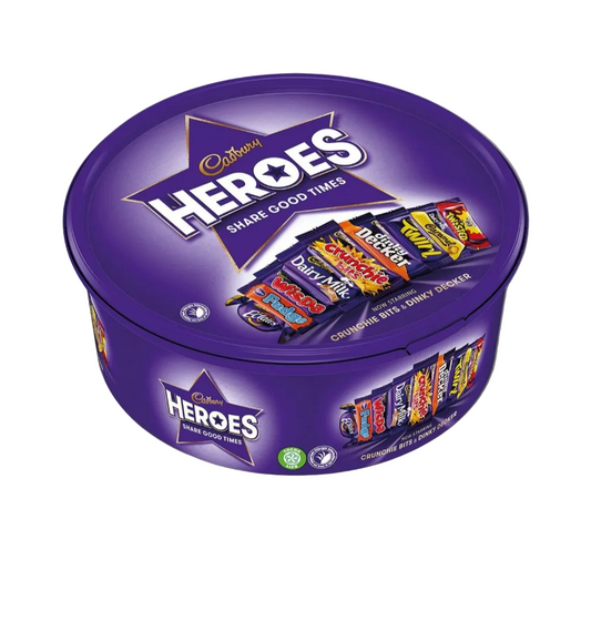 Purple Cadbury Heroes chocolate tin with candy bars on a light gray background