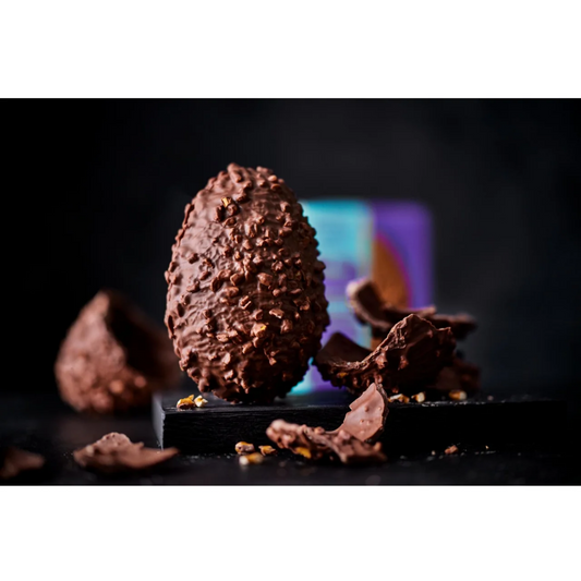 Hollow milk chocolate egg with salted pretzel pieces