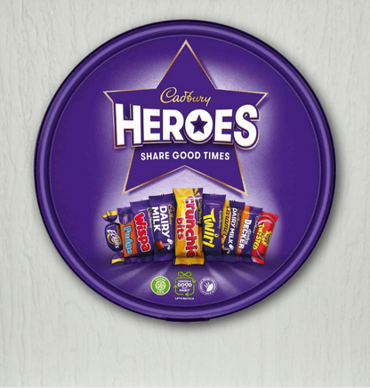 Cadbury Heroes chocolate packaging with a purple star-shaped lid on a light gray background