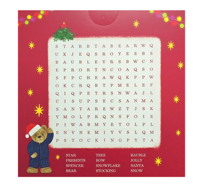 Christmas-themed word search puzzle with a teddy bear and festive decorations on a red background.
