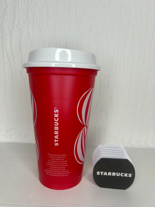 Festive red plastic mug with candy handle
