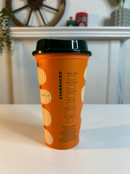 Side angle of Starbucks Halloween Pumpkin Orange Reusable Cup with logo