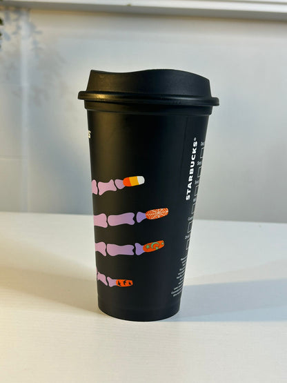 Side angle of Starbucks Skeleton Hand Cup with spooky design