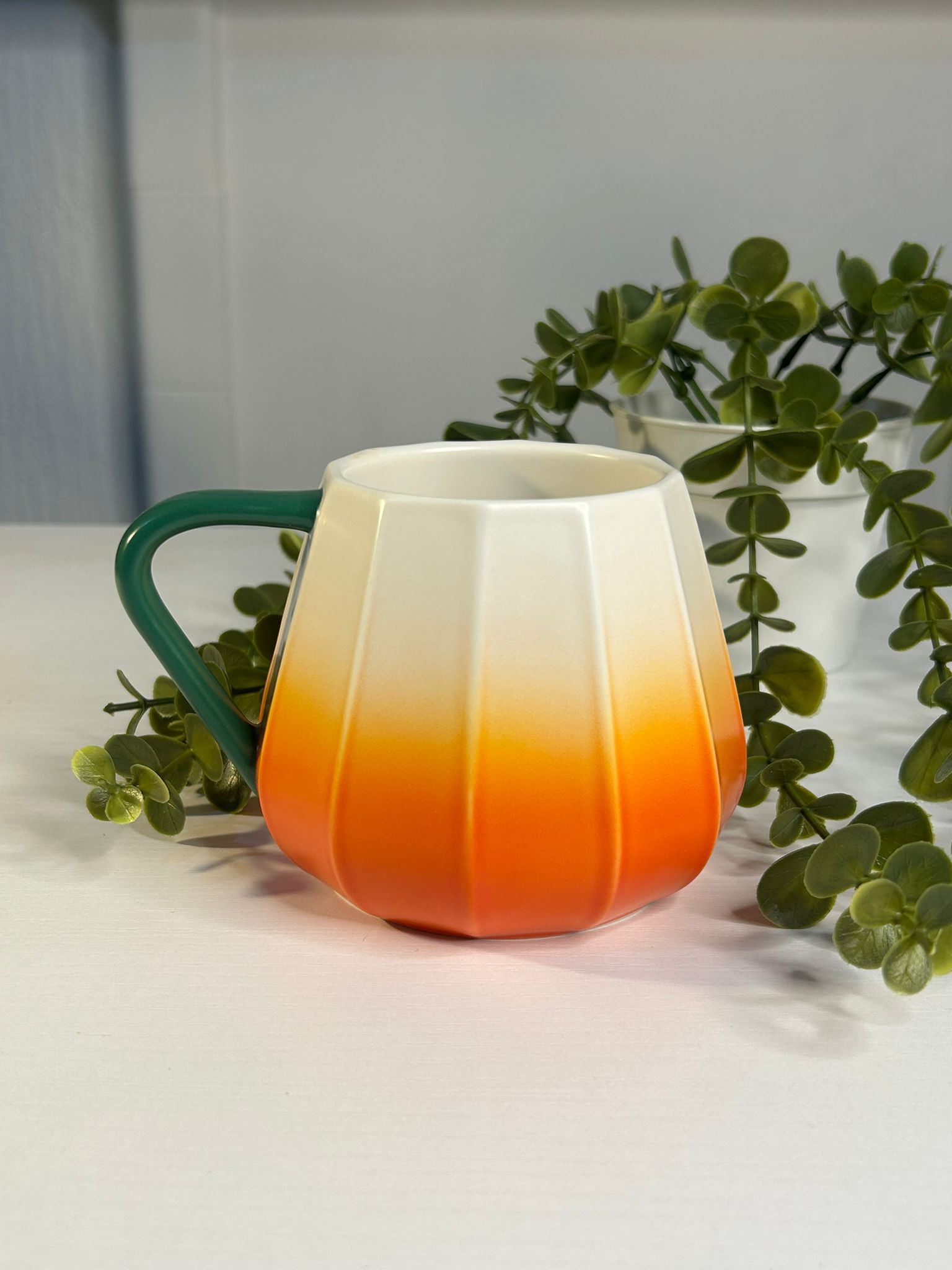 Side angle of Starbucks Pumpkin Ceramic Mug with festive Halloween design