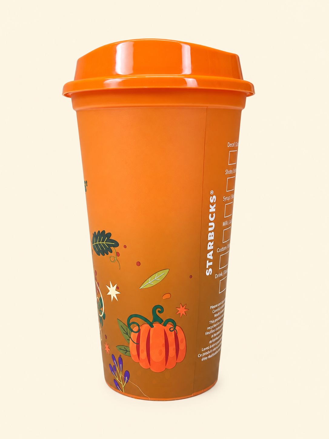 Starbucks 16oz fall cup featuring pumpkin and autumn leaves