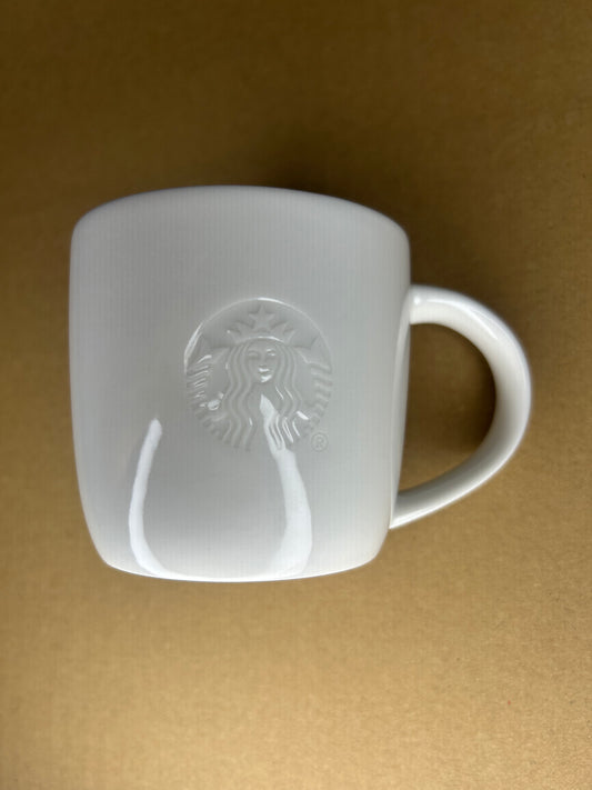 Side angle of Starbucks 8oz Short Mug with embossed siren logo
