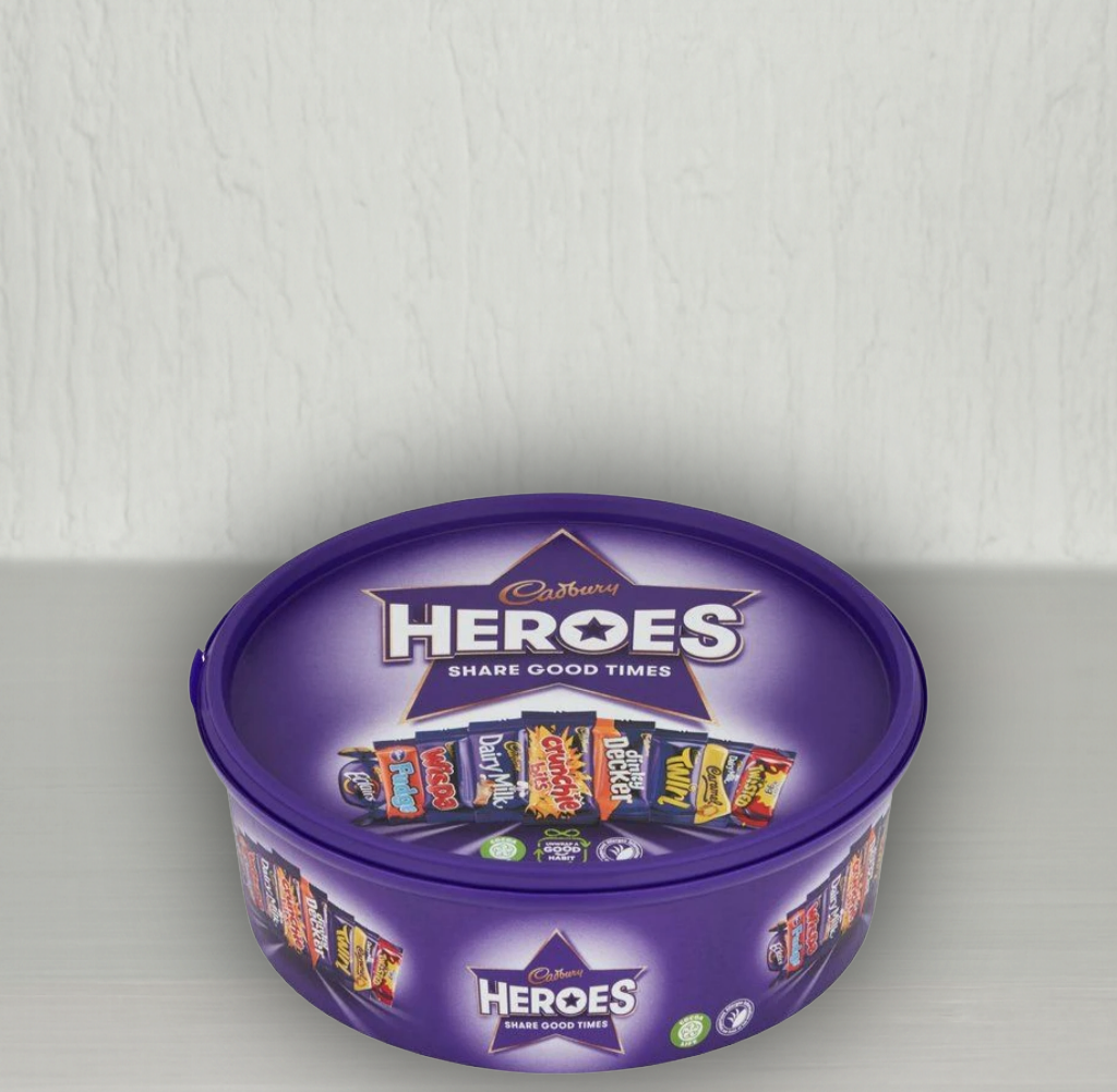 Cadbury Heroes chocolate tin with purple lid on a white background