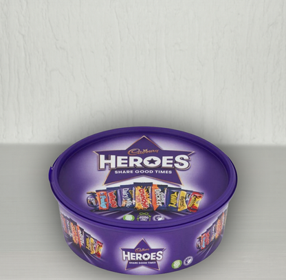 Cadbury Heroes chocolate tin with purple lid on a white background